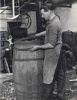 Fitting the hoops onto the finished cask.